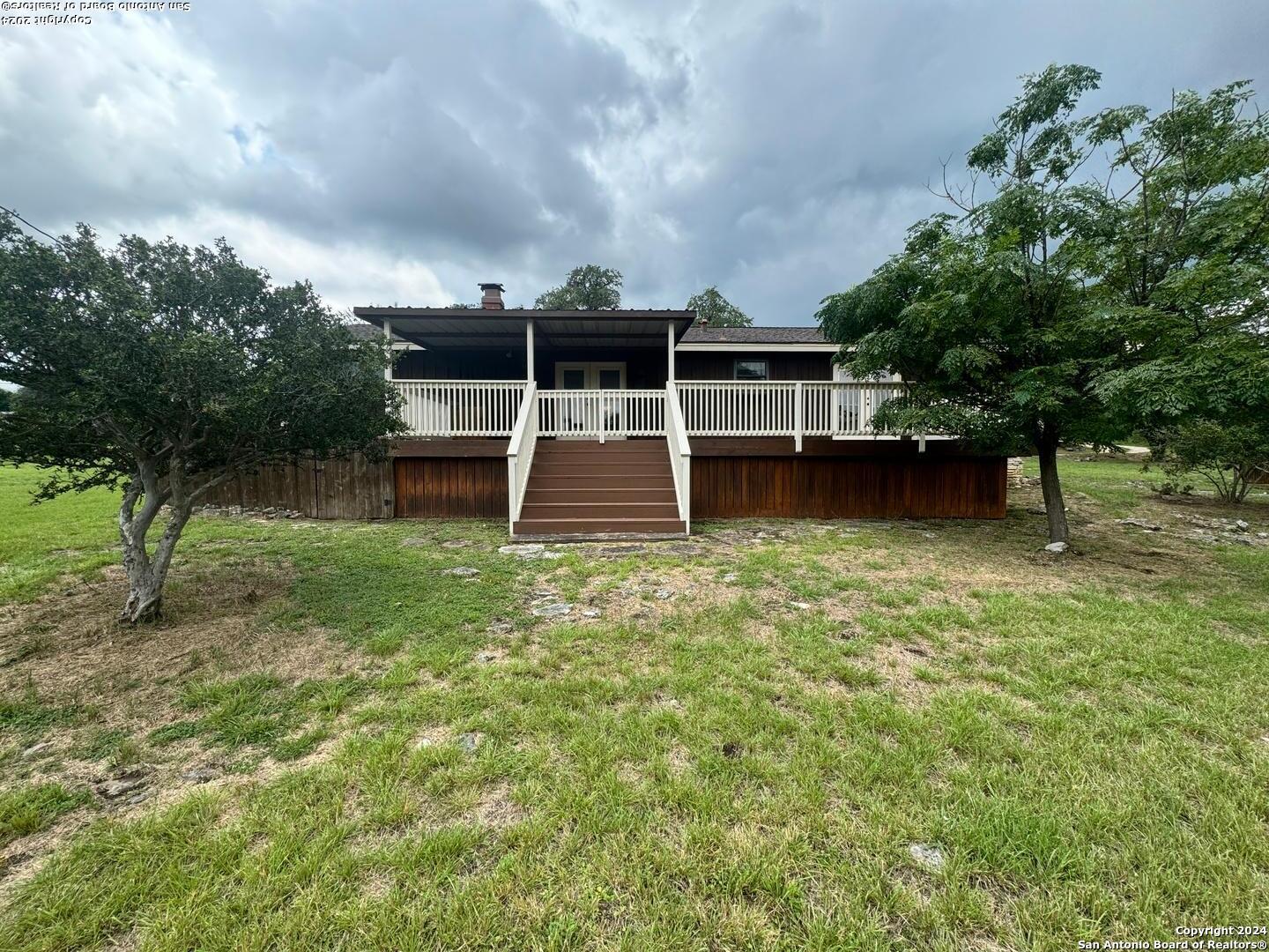 440 Cedar Springs Drive Spring Branch, TX 78070 - Photo 37 of 48 a backyard of a house with table and chairs