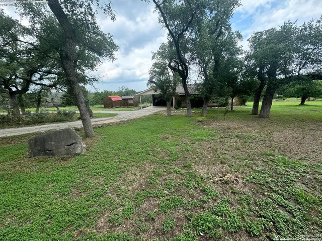 a view of outdoor space with deck and trees