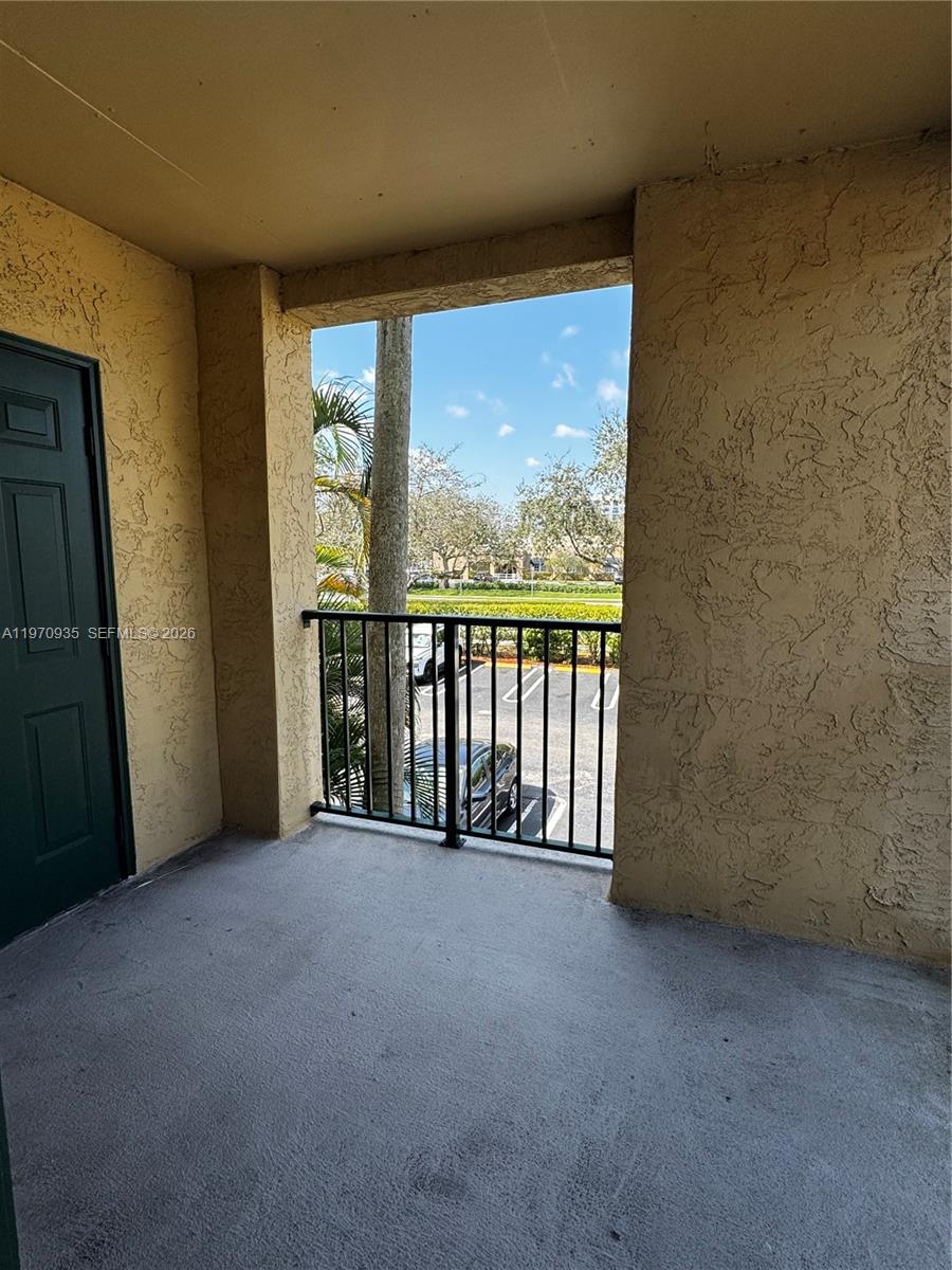 977 Riverside Drive, Unit 221 Coral Springs, FL 33071 - Photo 17 of 17 a view of an empty room with a large window