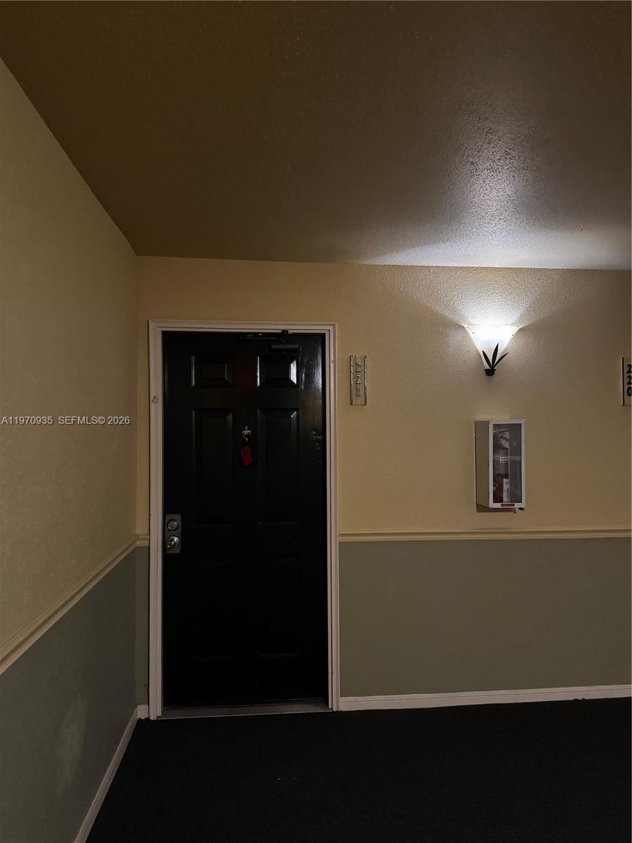 977 Riverside Drive, Unit 221 Coral Springs, FL 33071 - Photo 2 of 17 a view of hallway with window