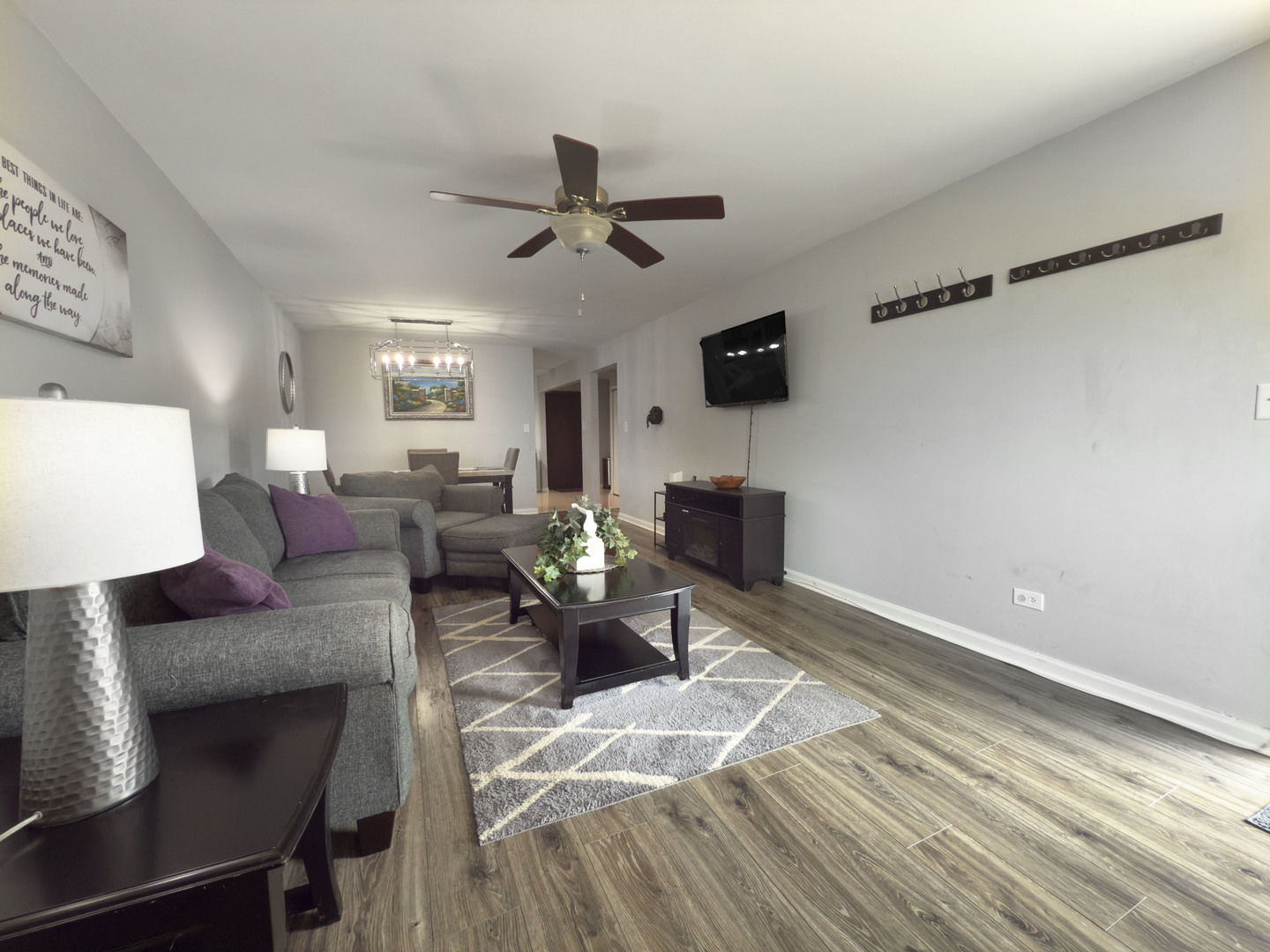 1313 Rebecca Road, Unit 118 Lombard, IL 60148 - Photo 7 of 19 a living room with furniture and a wooden floor