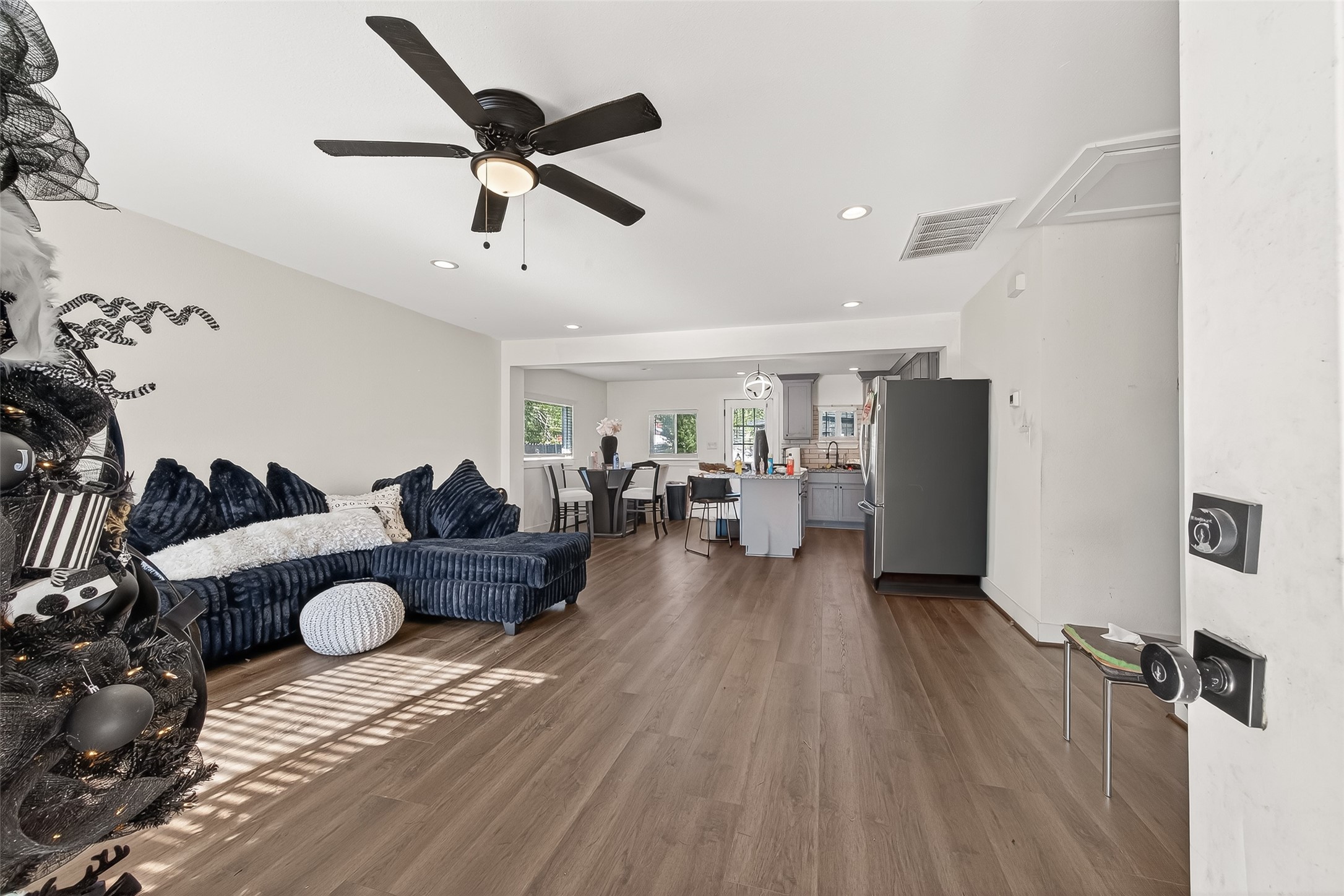 978 St Clair Street Houston, TX 77088 - Photo 3 of 14 a living room with furniture and a wooden floor