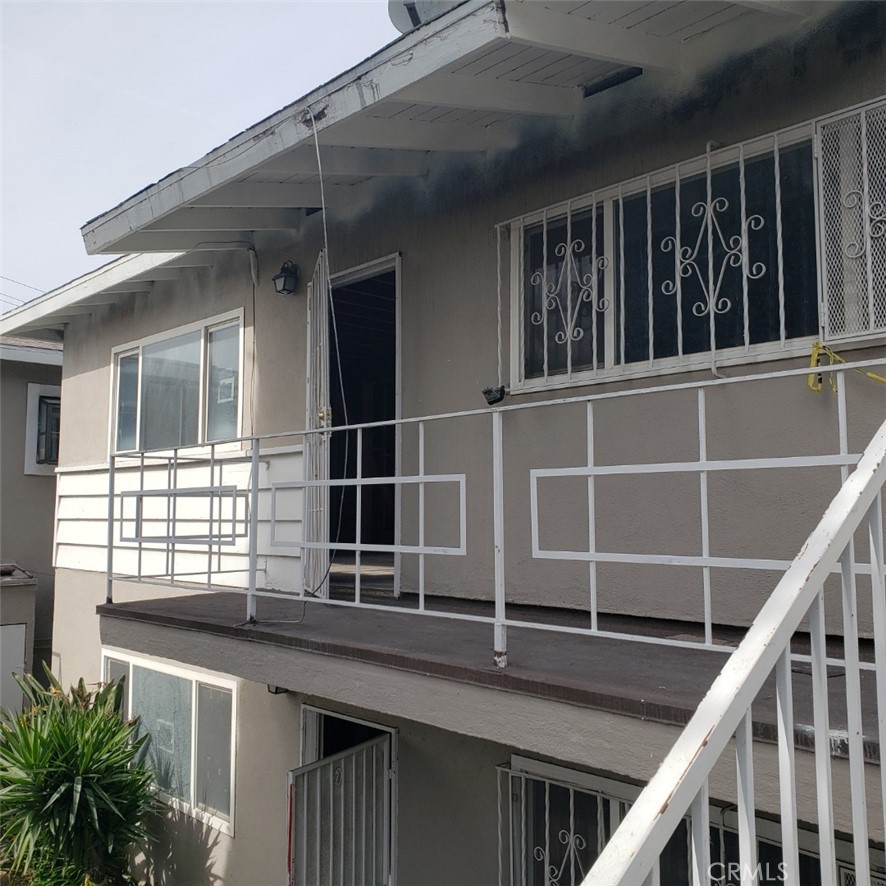 a balcony with window and outdoor space