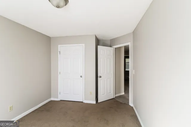 a bathroom with a toilet and a bath tub