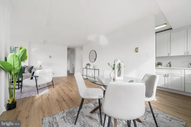 a view of a dining room with furniture window and wooden floor