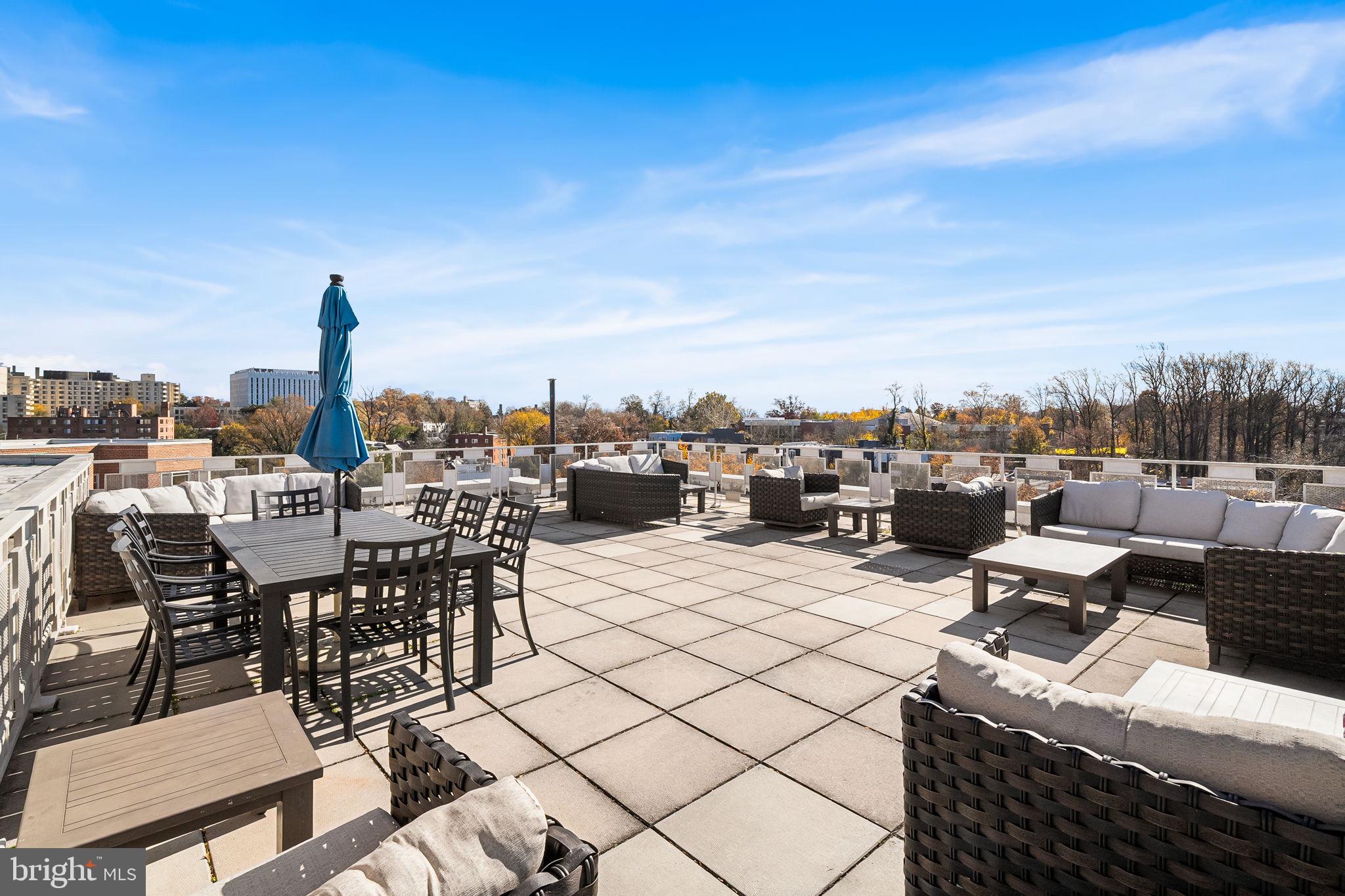 4000 Tunlaw Road Northwest, Unit 811 Washington, DC 20007 - Photo 23 of 51 a view of a terrace with furniture and city view
