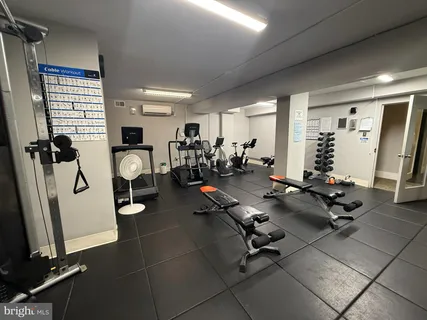 a bathroom with a glass door shower