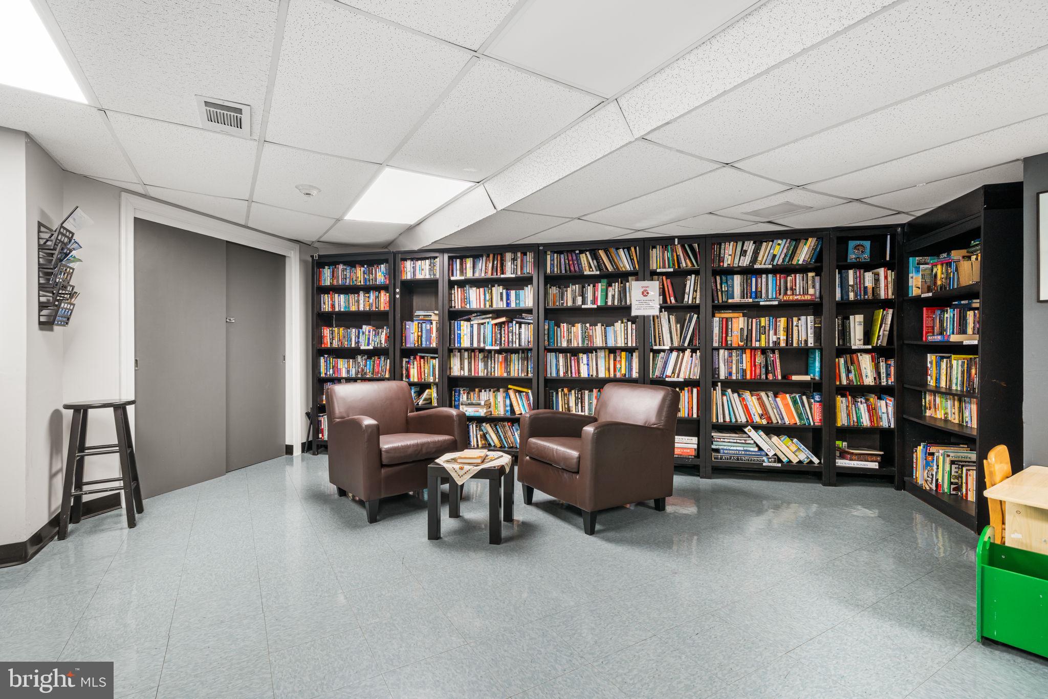 4000 Tunlaw Road Northwest, Unit 811 Washington, DC 20007 - Photo 31 of 51 a reading room with furniture and a book shelf