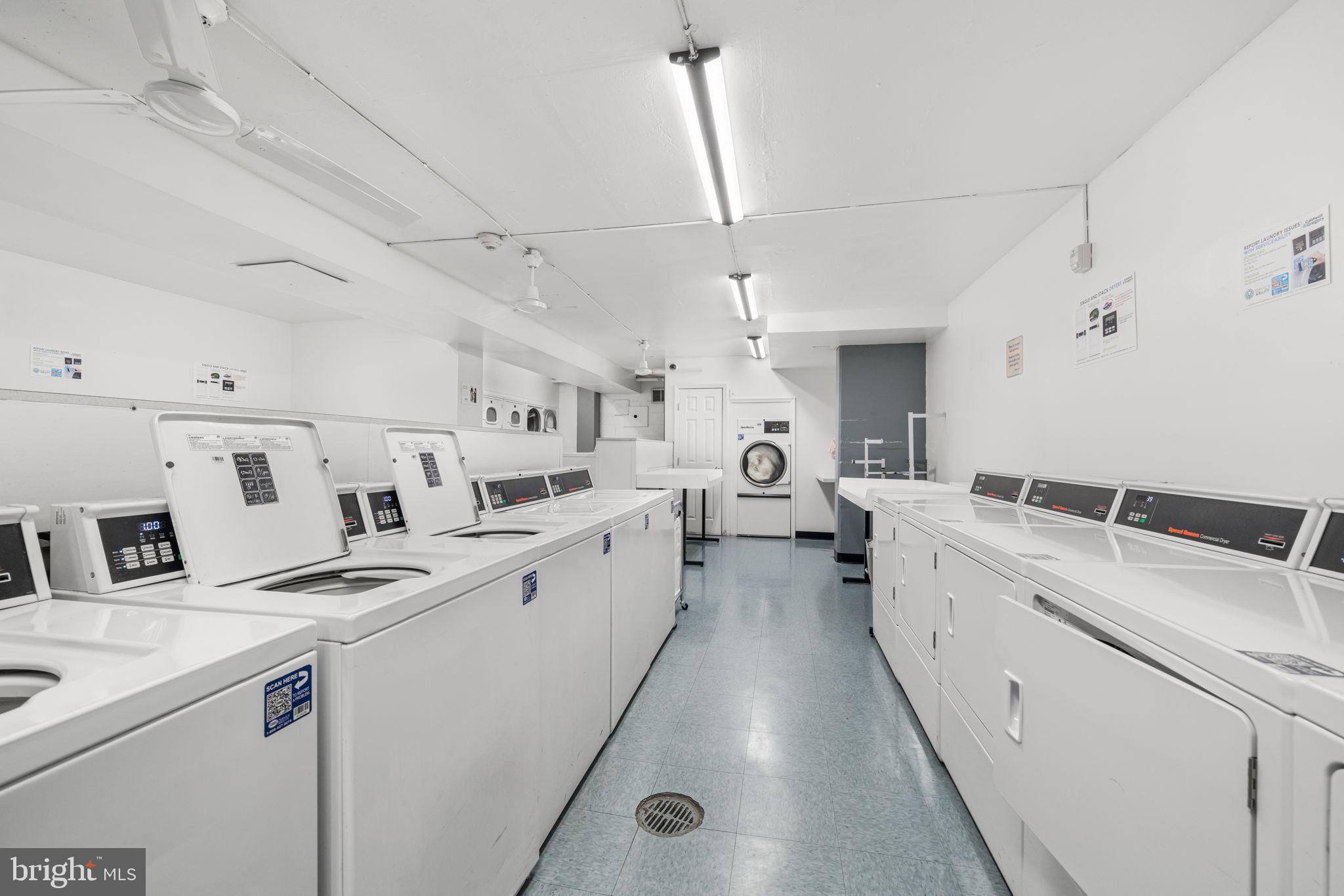 4000 Tunlaw Road Northwest, Unit 811 Washington, DC 20007 - Photo 37 of 51 a large white kitchen with lots of counter space and white appliances