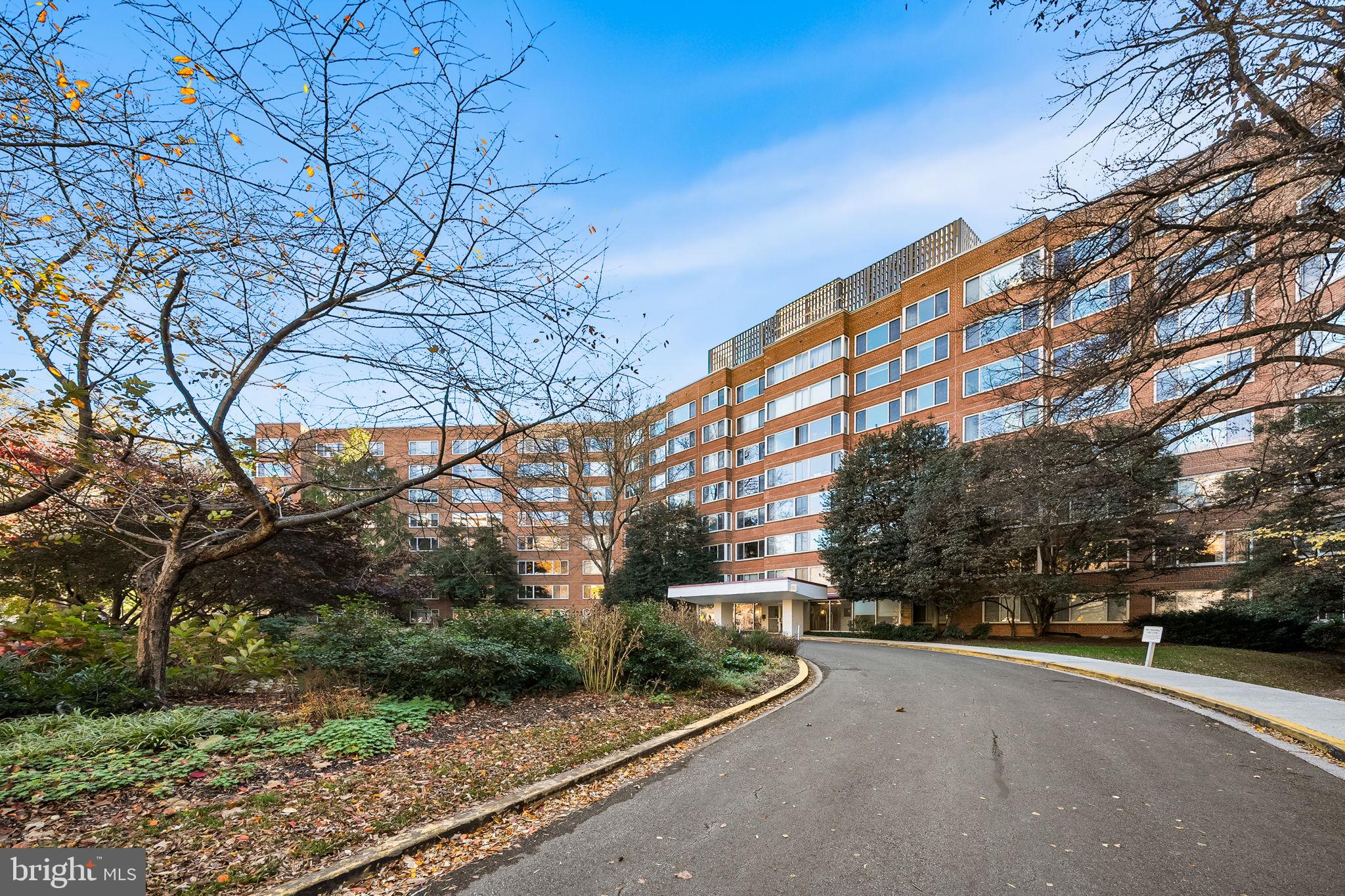 4000 Tunlaw Road Northwest, Unit 811 Washington, DC 20007 - Photo 38 of 51 a view of a building with a yard