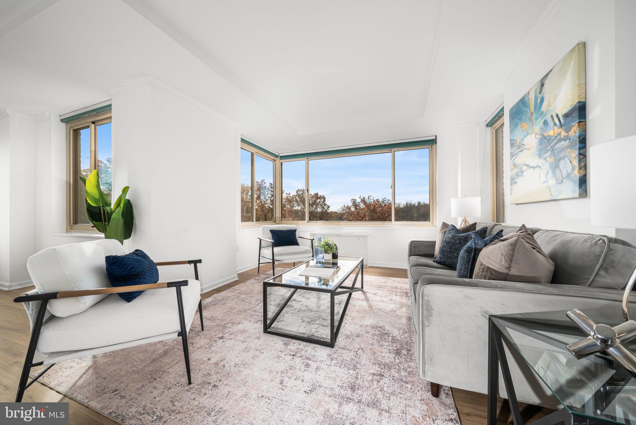 4000 Tunlaw Road Northwest, Unit 811 Washington, DC 20007 - Photo 5 of 51 a living room with furniture and a large window