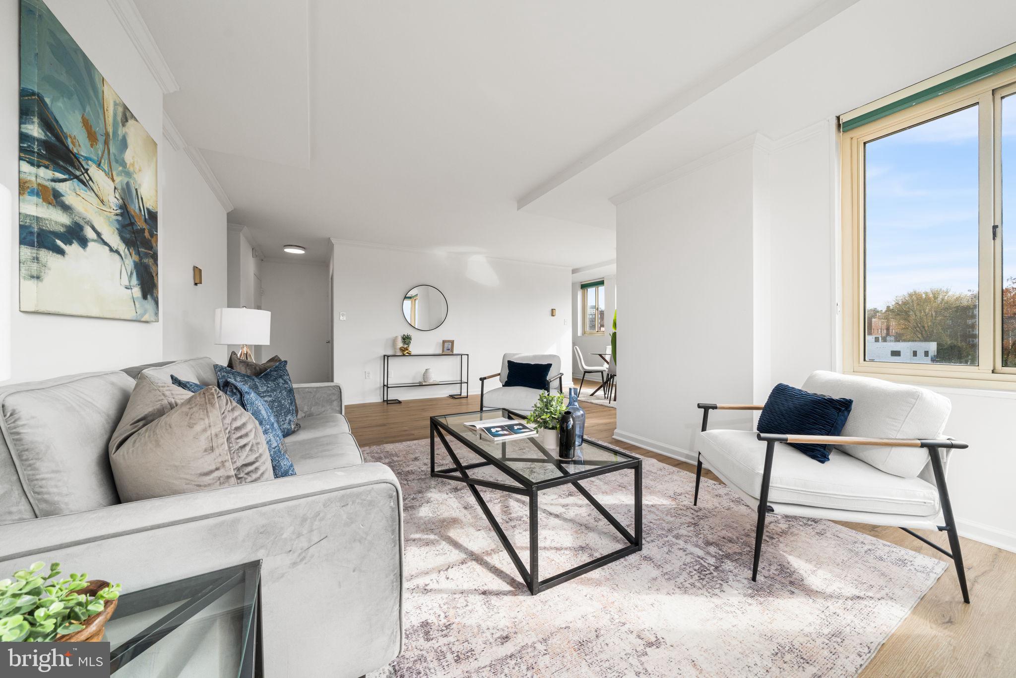 4000 Tunlaw Road Northwest, Unit 811 Washington, DC 20007 - Photo 7 of 51 a living room with furniture and a large window