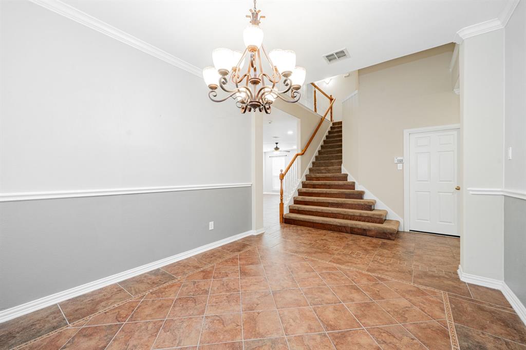 1805 Sumac Drive Flower Mound, TX 75028 - Photo 12 of 40 a view of entryway and hall with a chandelier