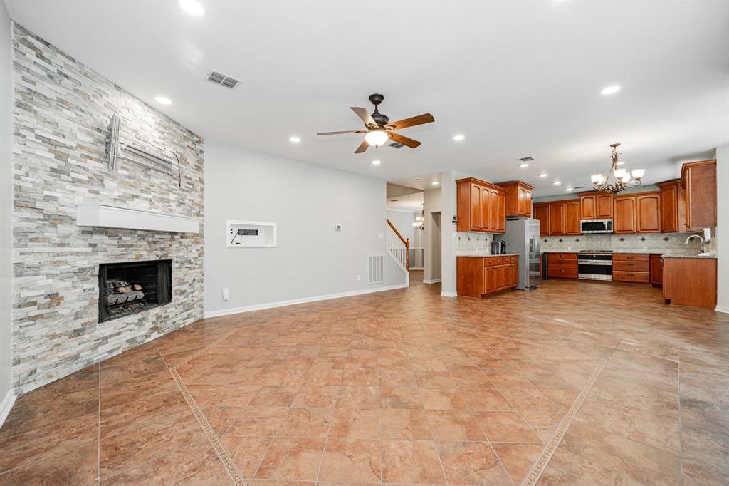 1805 Sumac Drive Flower Mound, TX 75028 - Photo 17 of 40 a view of kitchen with furniture and fireplace