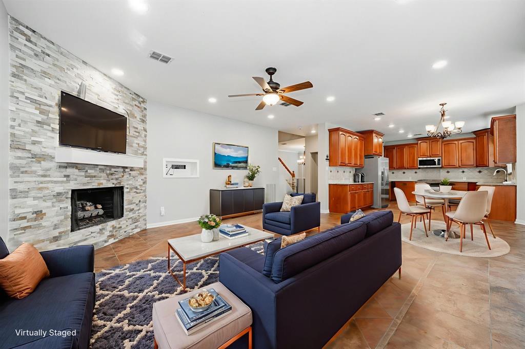 1805 Sumac Drive Flower Mound, TX 75028 - Photo 18 of 40 a living room with furniture fireplace and flat screen tv