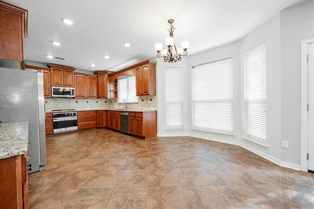 1805 Sumac Drive Flower Mound, TX 75028 - Photo 4 of 40 a view of kitchen with sink cabinets and window