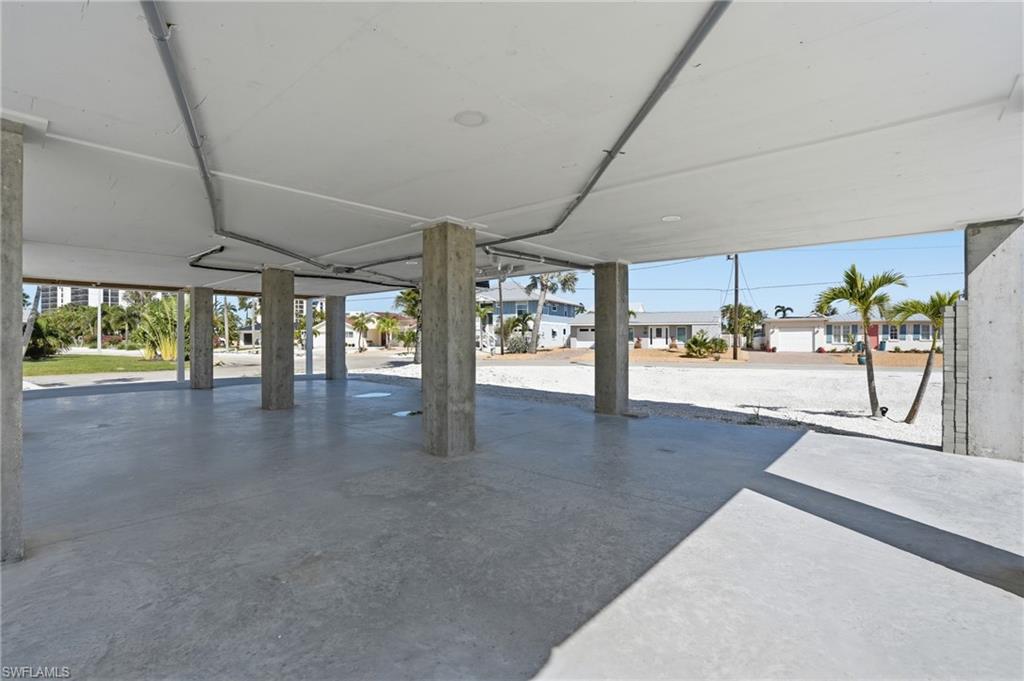 1 Fairview Boulevard Fort Myers Beach, FL 33931 - Photo 40 of 48 Expansive covered concrete pad with multiple support pillars - Virtually Edited Image