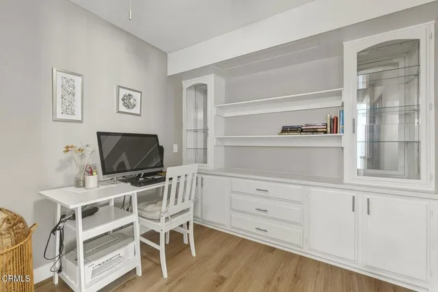 a view of a workspace with furniture