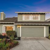 a front view of a house with garage