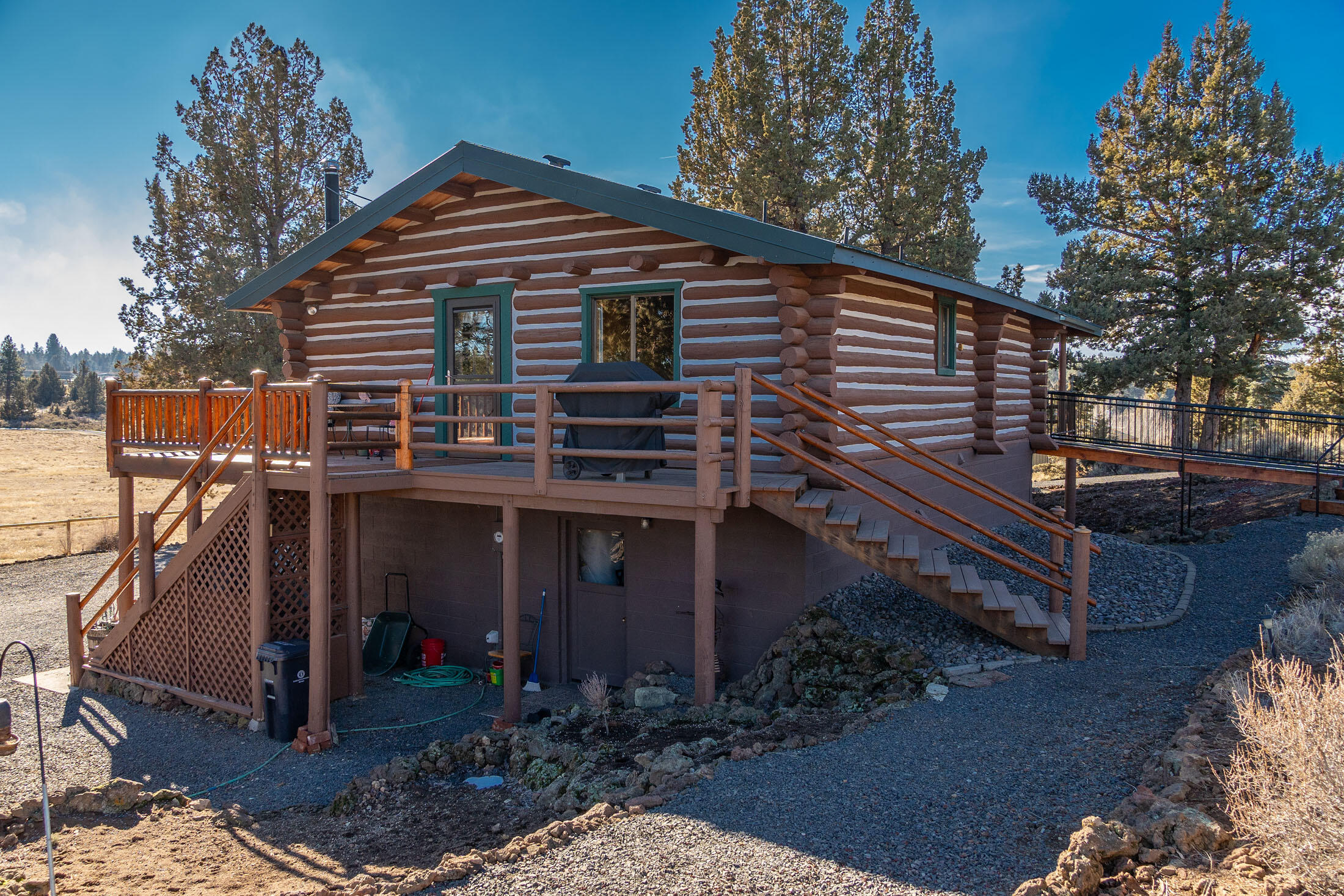 60384 Arnold Market Road Bend, OR 97702 - Photo 37 of 93 a front view of a house with a yard