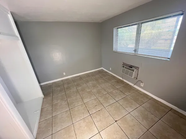 a kitchen with a stove a sink and a refrigerator