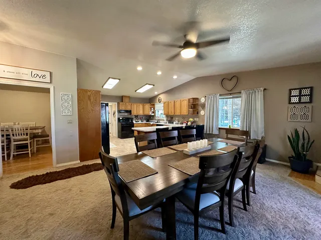 a view of a room with furniture and potted plant