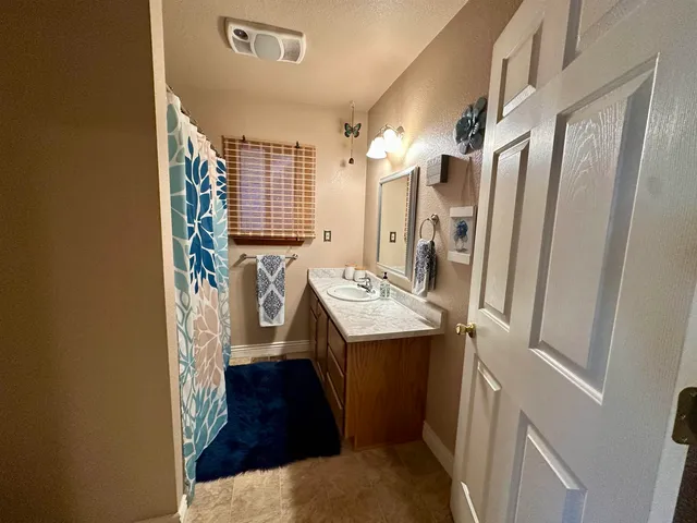 a bedroom with bed and window