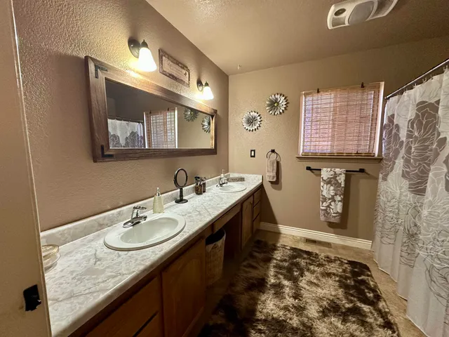 a backyard of a house with barbeque oven