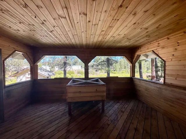 a patio with a table and chairs