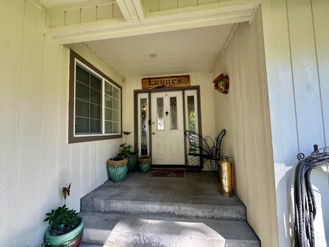 a kitchen with stainless steel appliances granite countertop a stove sink and cabinets
