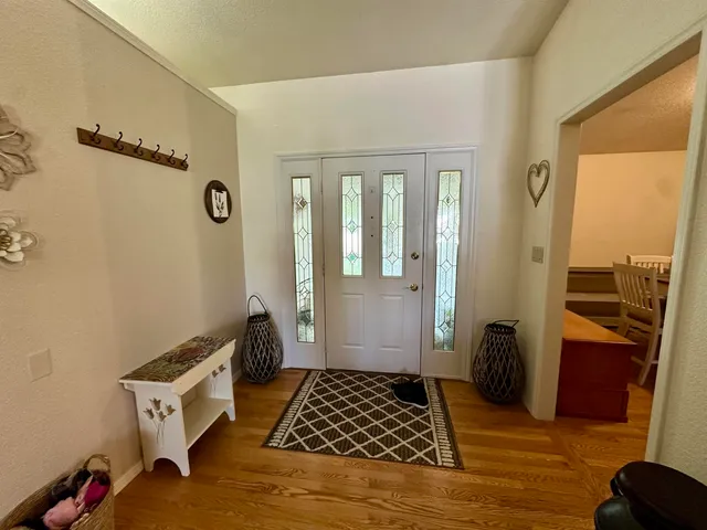 a view of a dining room with furniture and window