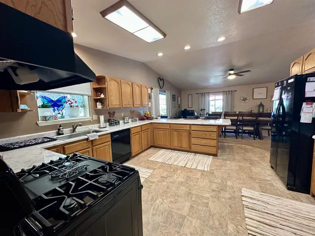 a bed room with a bed window and a television