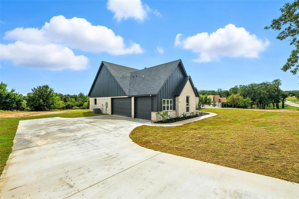 1012 Freedom Court Weatherford, TX 76088 - Photo 3 of 38 a view of house with swimming pool and yard
