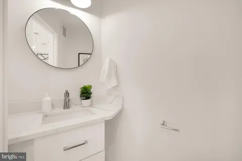 a dining room with furniture and a window