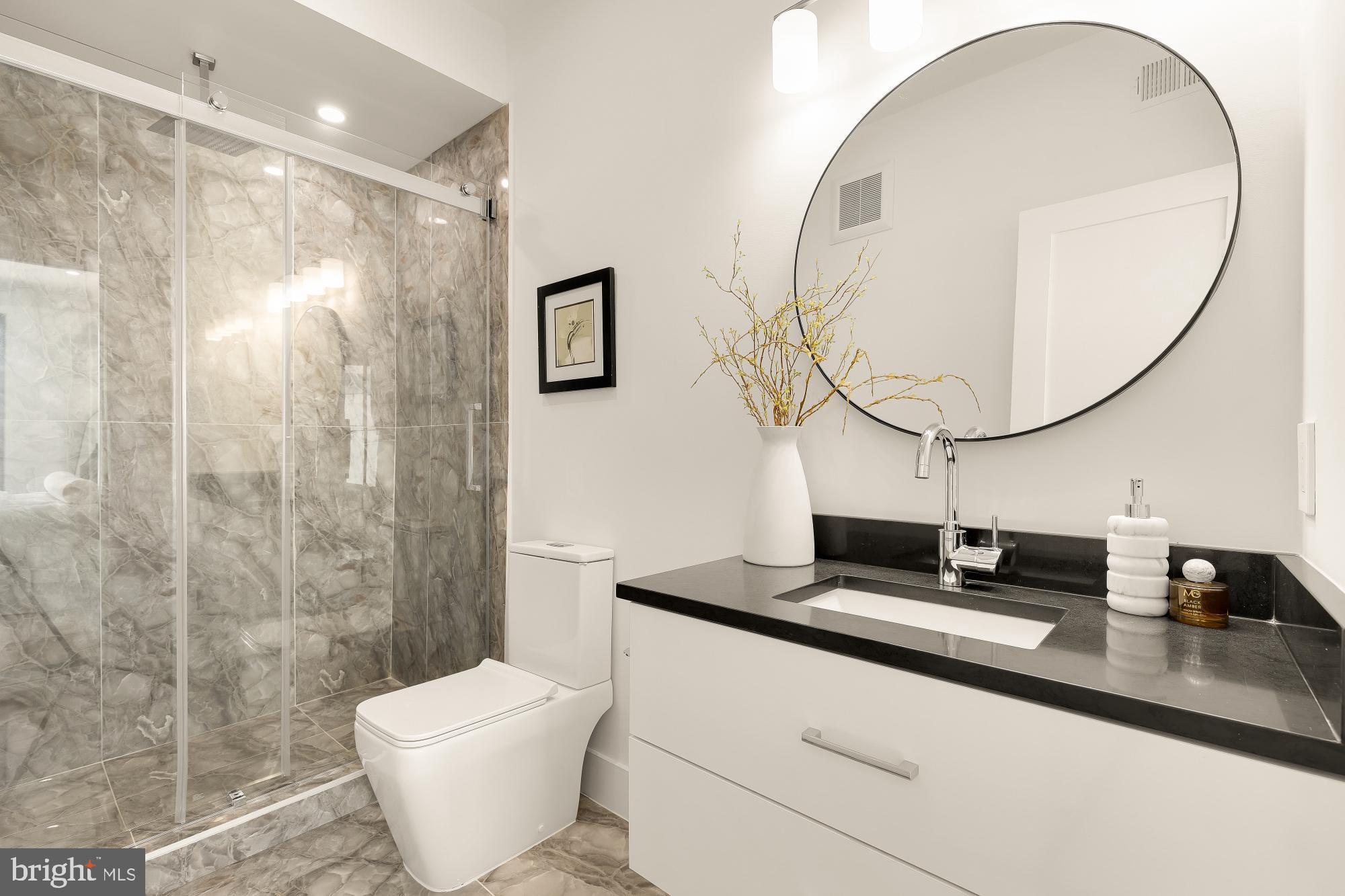 1850 Capitol Avenue Northeast Washington, DC 20002 - Photo 19 of 42 a bathroom with a toilet sink and mirror