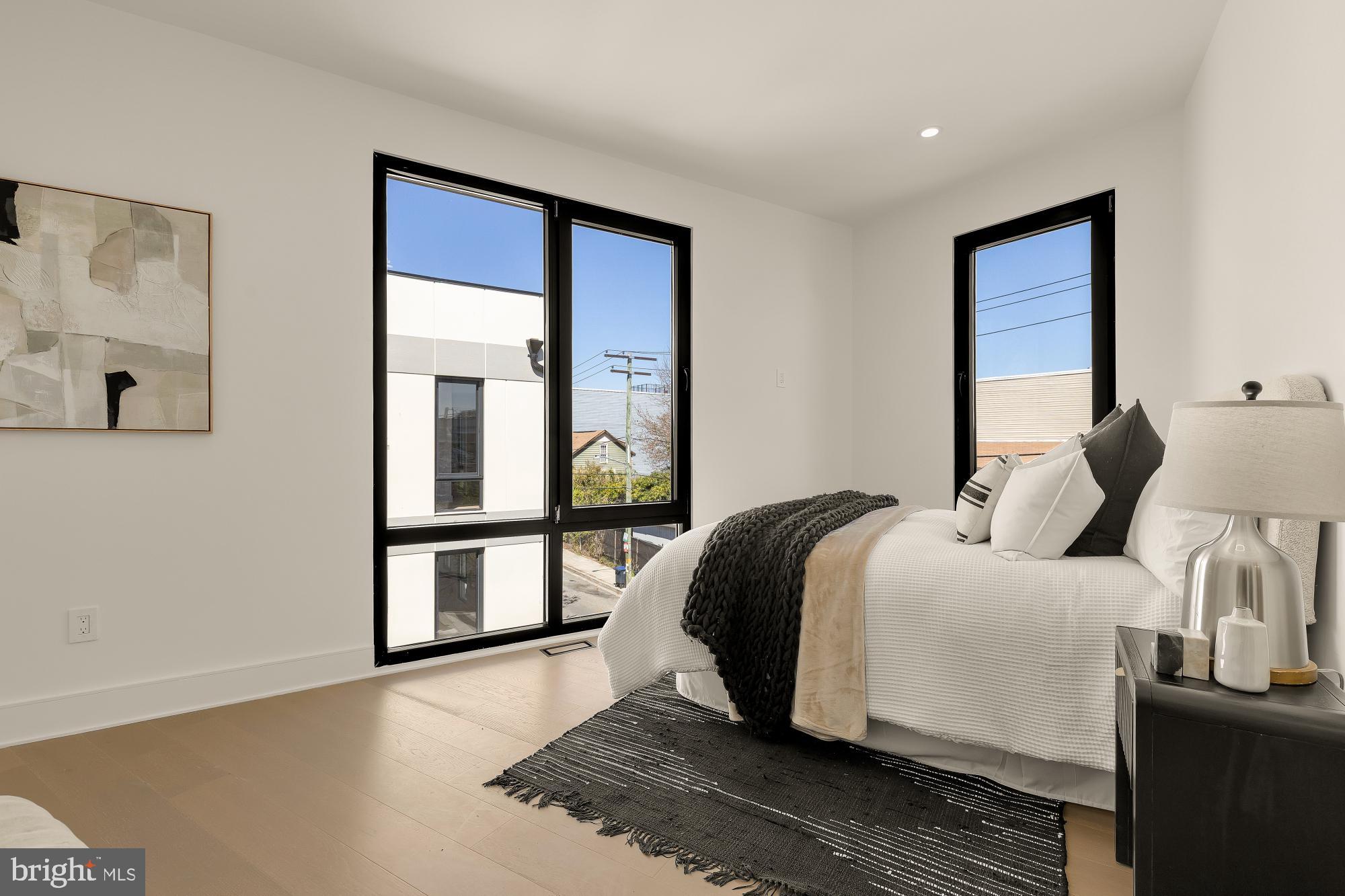 1850 Capitol Avenue Northeast Washington, DC 20002 - Photo 33 of 42 a bedroom with a bed and a large window
