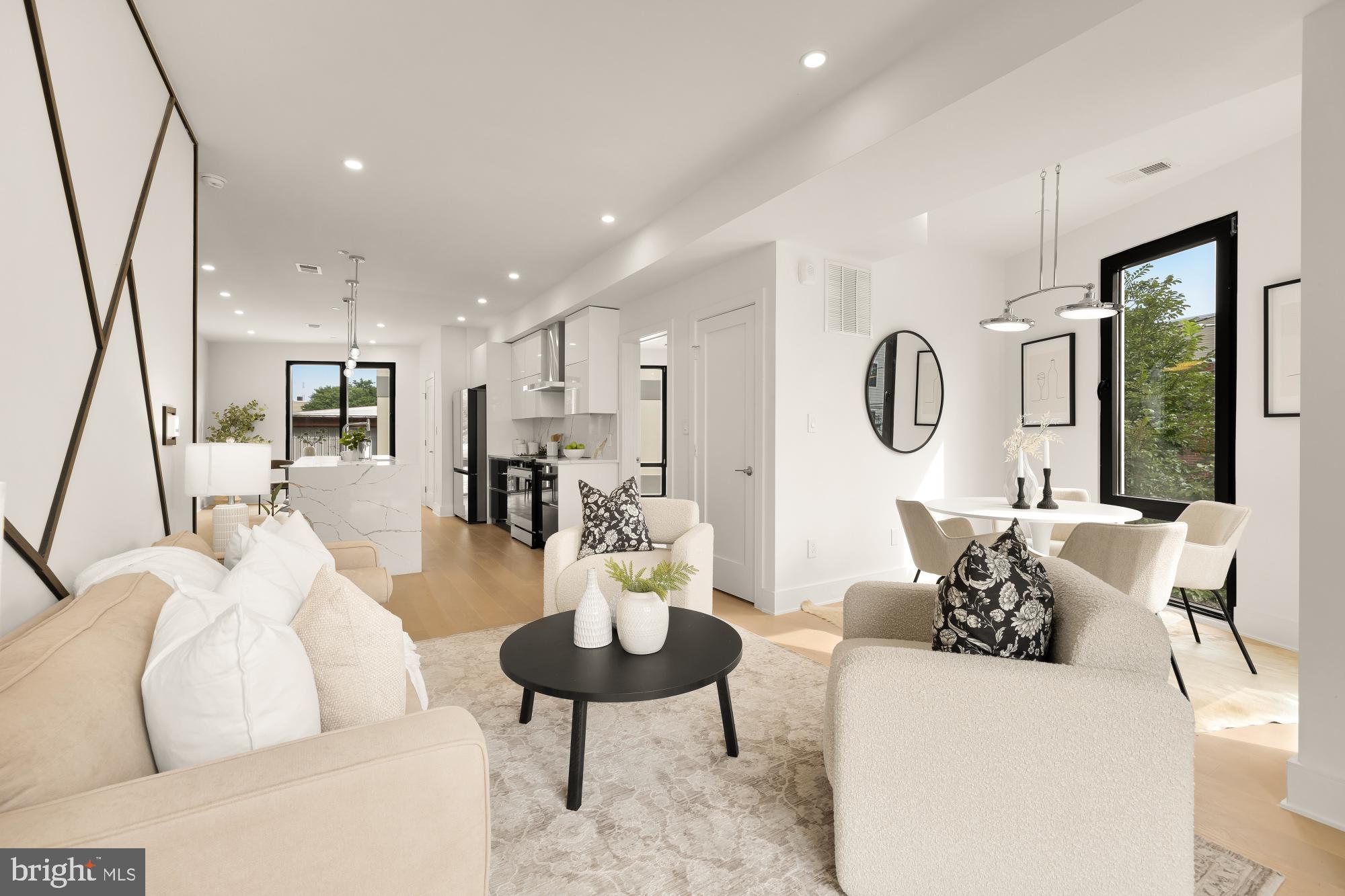 1850 Capitol Avenue Northeast Washington, DC 20002 - Photo 7 of 39 a living room with furniture kitchen view and a large window