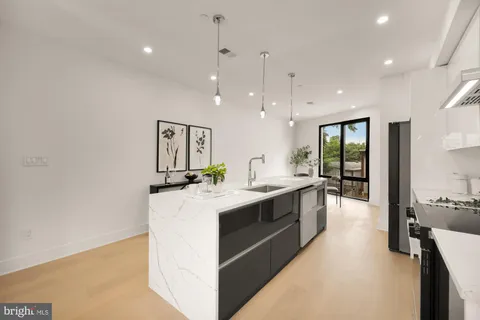 a kitchen with a stove and cabinets