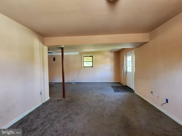a view of an empty room and window