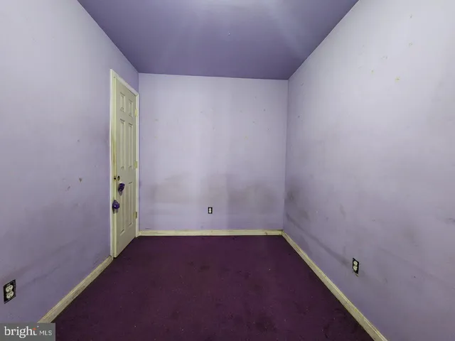 an empty room with a empty space and window