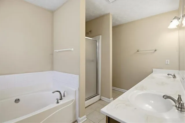 a bathroom with a tub and sink