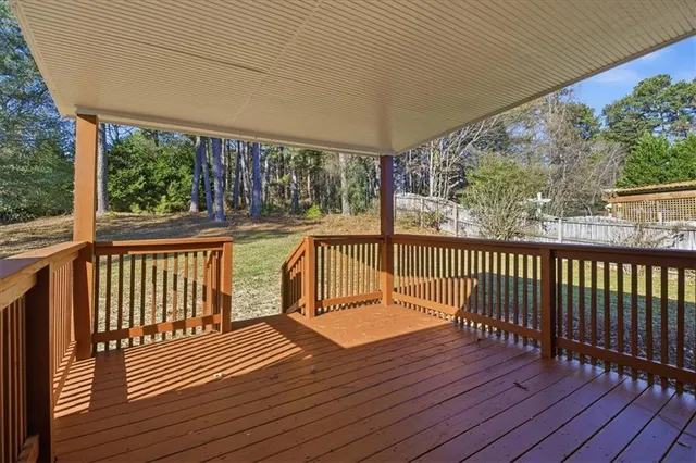 a view of deck with wooden floor and fence