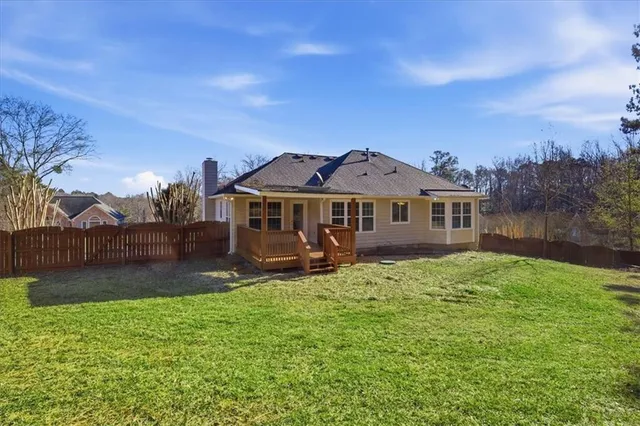a view of a house with a yard