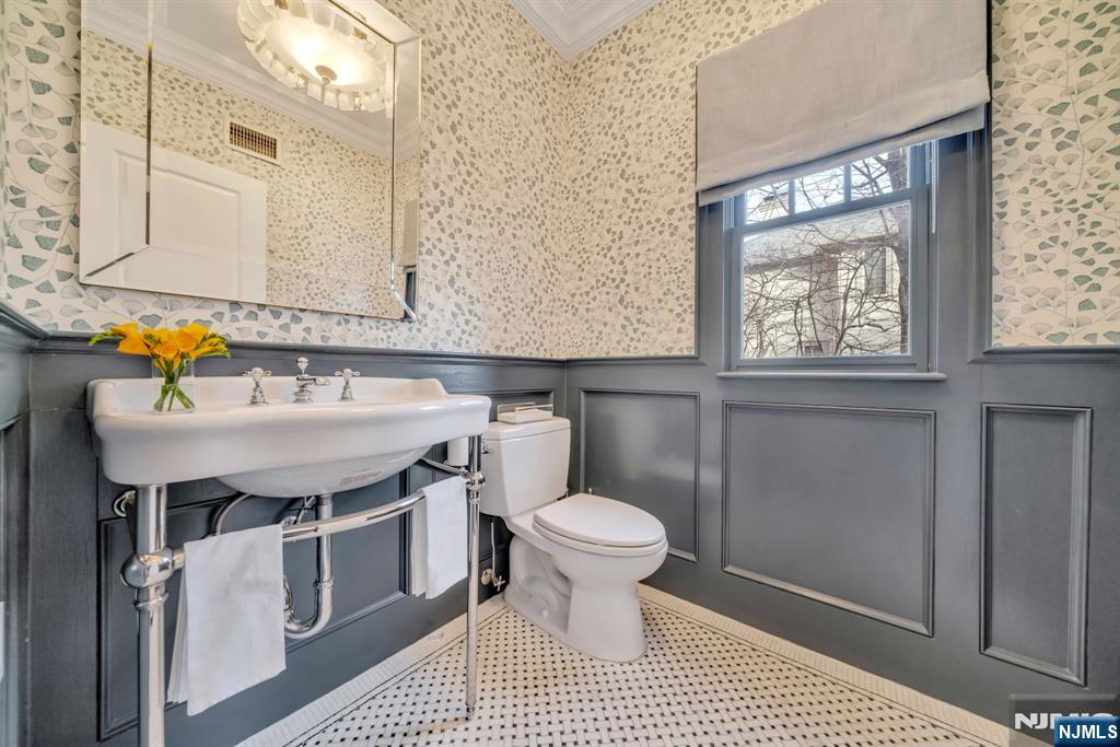187 Buckingham Road Tenafly, NJ 07670 - Photo 12 of 50 a bathroom with a sink toilet and a mirror