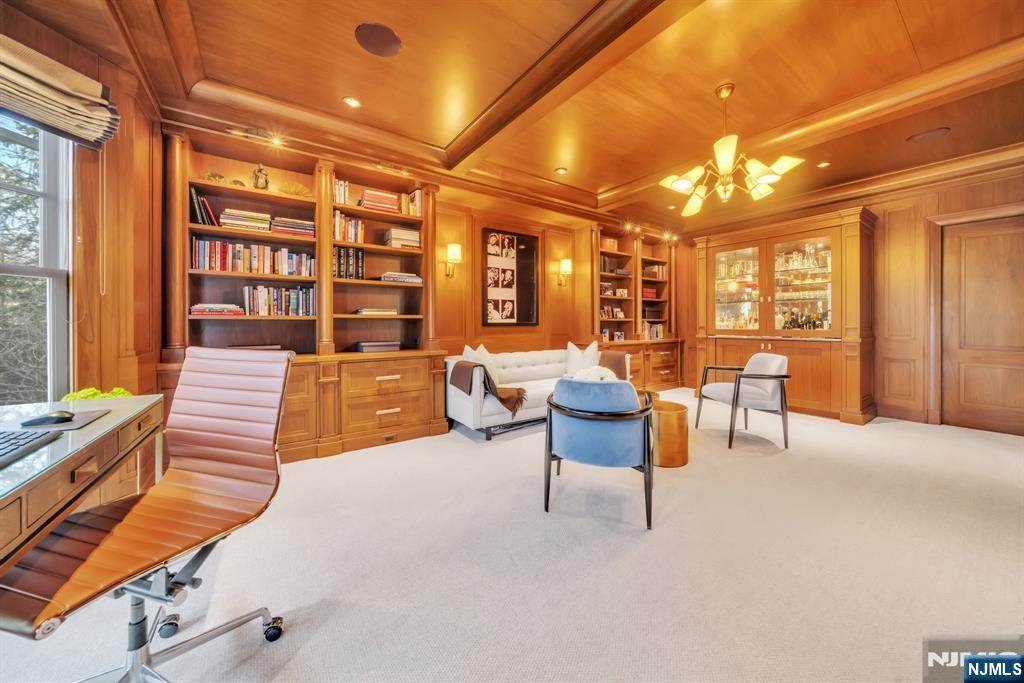 187 Buckingham Road Tenafly, NJ 07670 - Photo 13 of 50 a living room with furniture a chandelier and large window