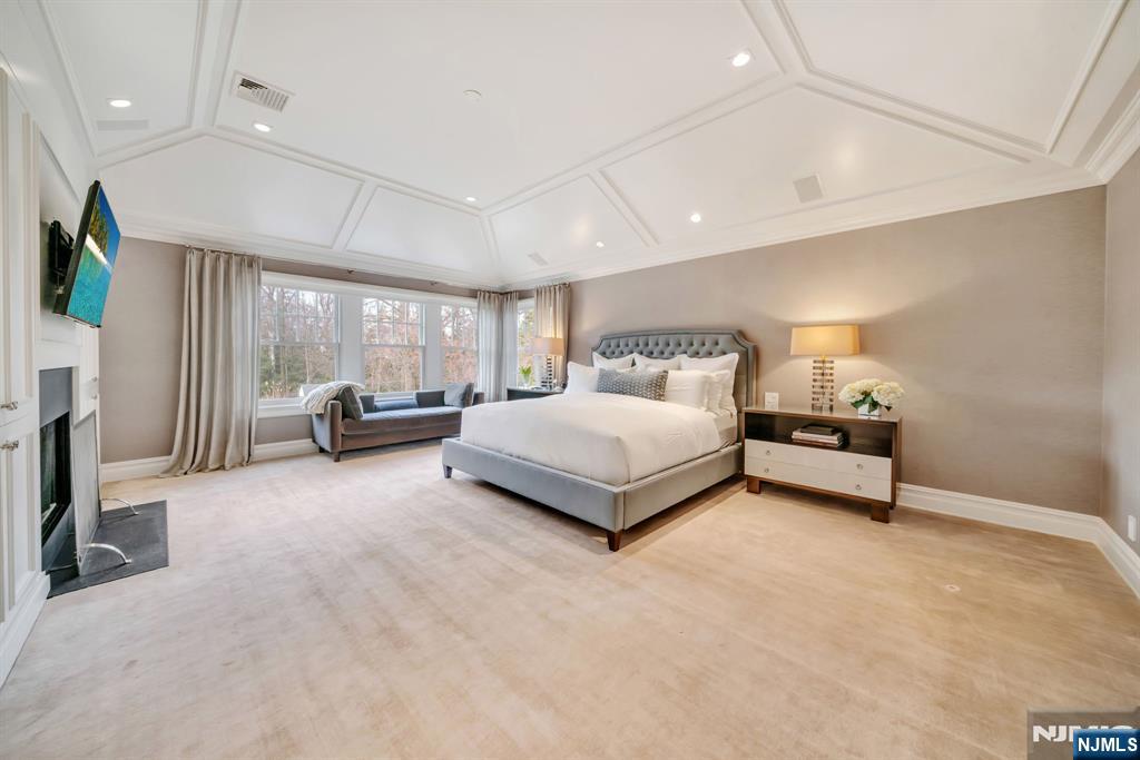 187 Buckingham Road Tenafly, NJ 07670 - Photo 28 of 50 a spacious bedroom with a bed couch and a window