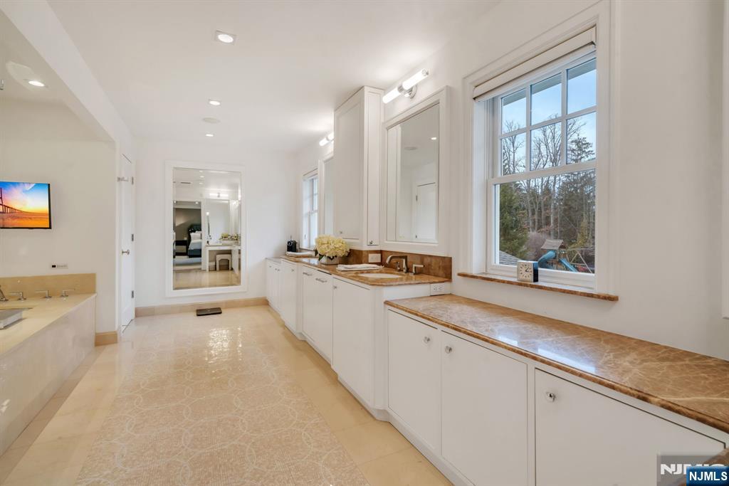 187 Buckingham Road Tenafly, NJ 07670 - Photo 29 of 50 a large white kitchen with a large window