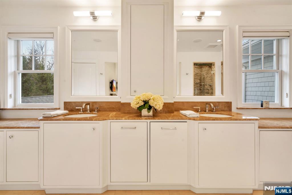 187 Buckingham Road Tenafly, NJ 07670 - Photo 30 of 50 a bathroom with a sink and a mirror