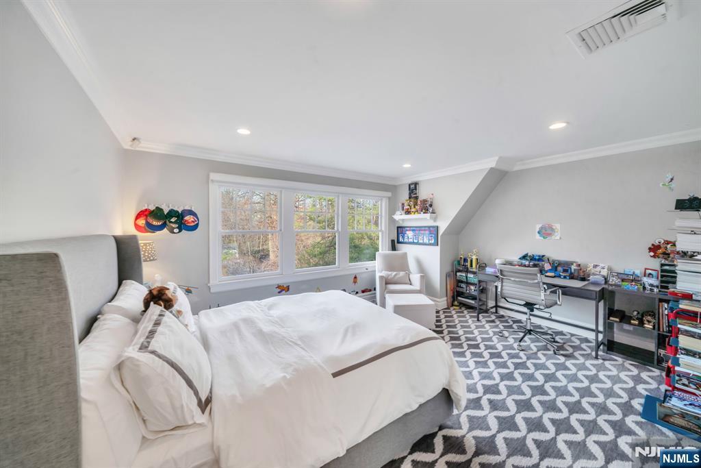 187 Buckingham Road Tenafly, NJ 07670 - Photo 36 of 50 a bed room with a bed and a chair