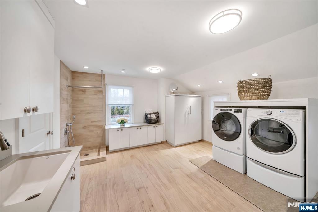187 Buckingham Road Tenafly, NJ 07670 - Photo 39 of 50 a view of a kitchen with a sink wooden floor and windows